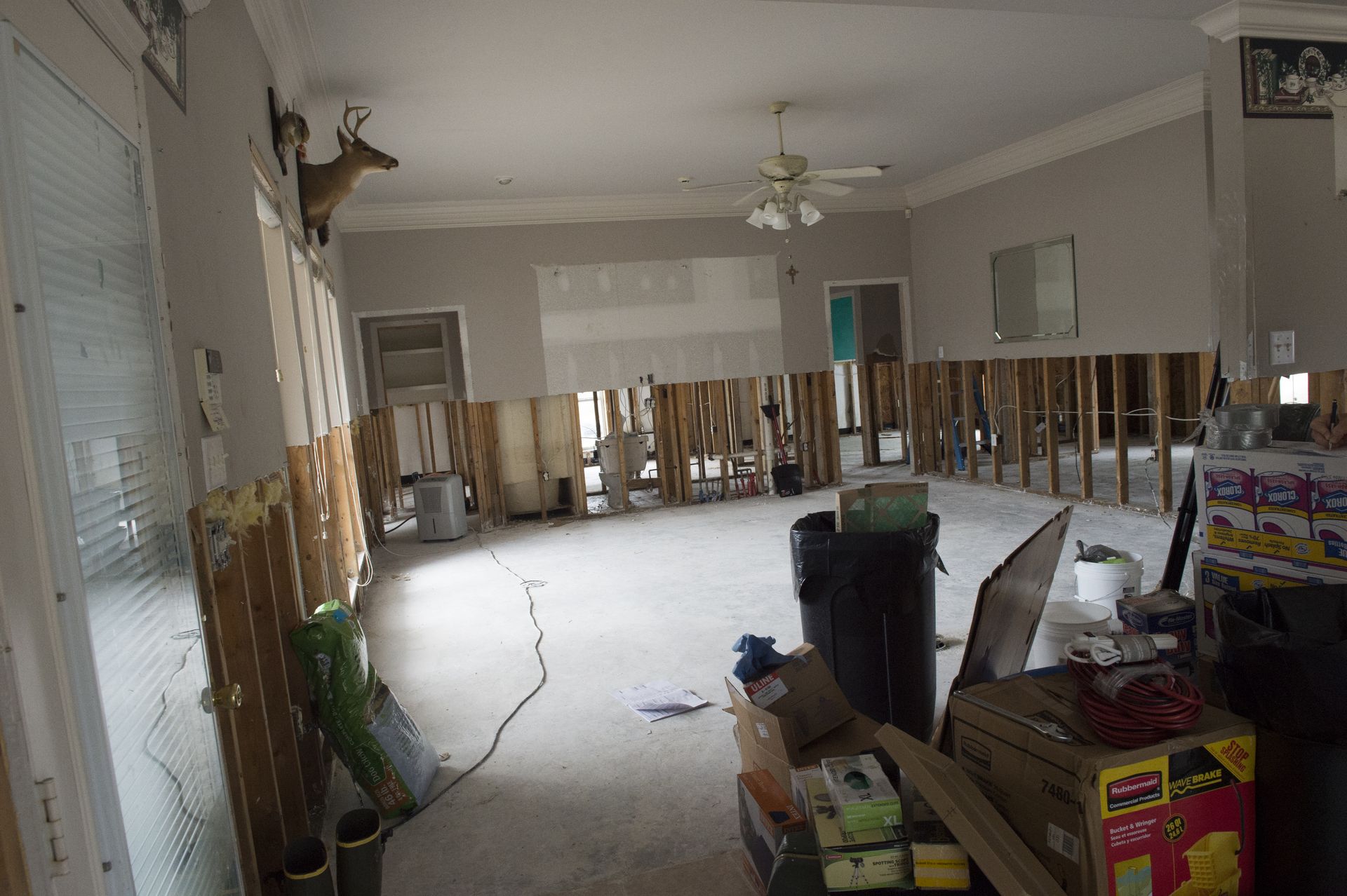 Interior of a flood-damaged home with saturated wallboard removed